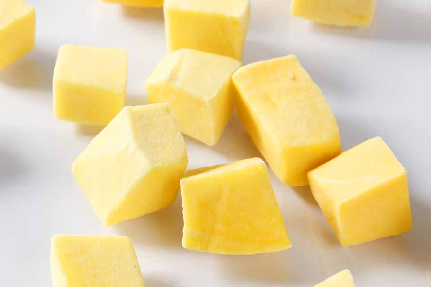 diced mango on white background